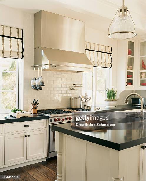 traditional kitchen with white cabinets - kitchen island stock pictures, royalty-free photos & images