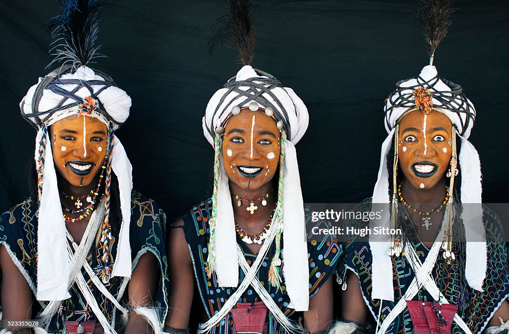Portrait of tribal men in traditional clothing and face paint