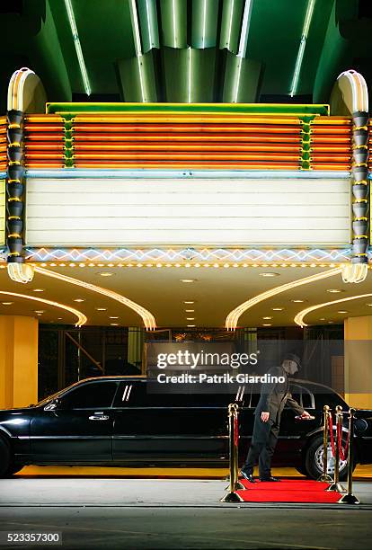 driver opening limo door at premiere - film premiere stock pictures, royalty-free photos & images