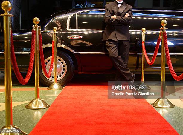 chauffeur waiting for star at red carpet event - limousine fotografías e imágenes de stock