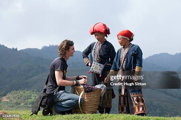 male european tourist travelling through sapa. vietnam - indigenous culture stock-fotos und bilder