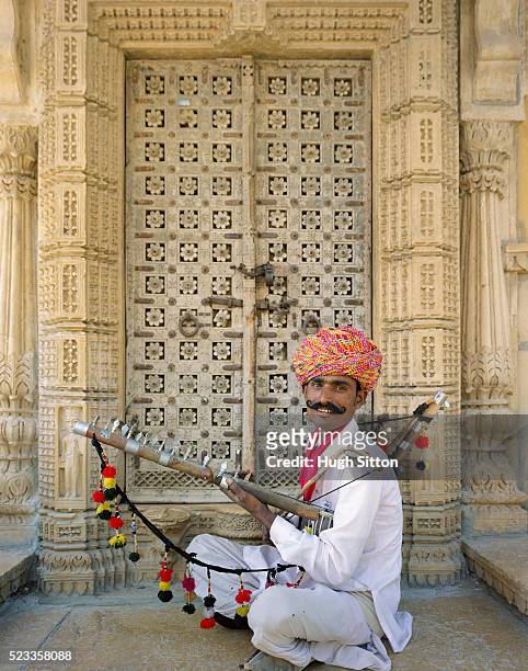 portrait of rajasthani musician - hugh sitton india stock pictures, royalty-free photos & images