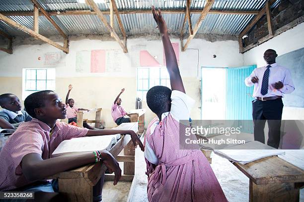 schoolchildren (6-9) in primary school, maasai area, kenya - native african girls stock pictures, royalty-free photos & images