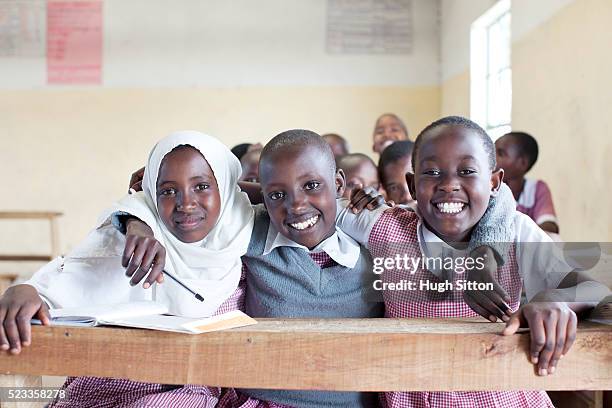 schoolchildren (8-9) in primary school, maasai area, kenya - east africa stock pictures, royalty-free photos & images