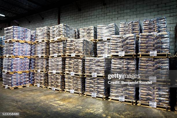 building materials in warehouse - construction material stockfoto's en -beelden