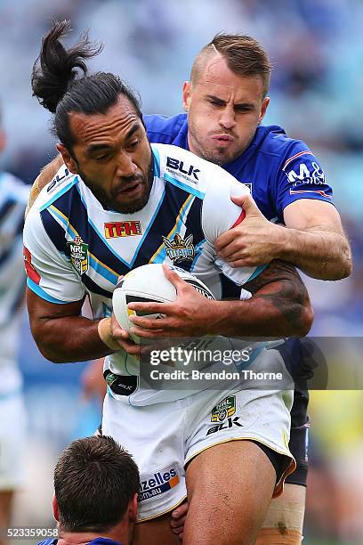 Zeb Taia of the Titans is tackled by Josh Reynolds of the Bulldogs during the round eight NRL match between the Canterbury Bulldogs and the Gold...