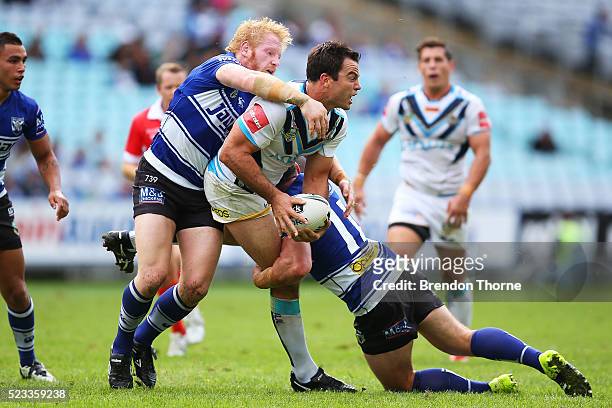 David Shillington of the Titans is tackled by James Graham of the Bulldogs during the round eight NRL match between the Canterbury Bulldogs and the...
