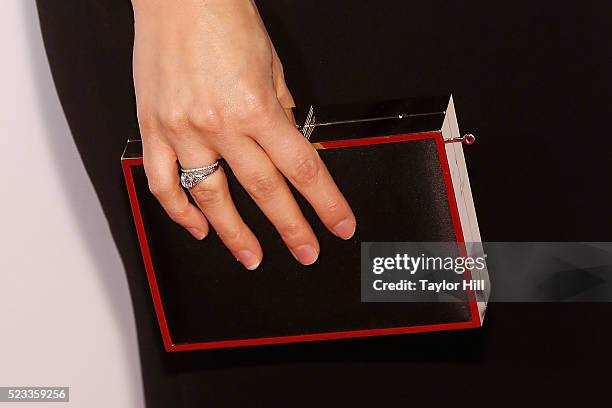 America Ferrera, ring detail, clutch detail, attends the premiere of "Special Correspondents" at Borough of Manhattan Community College during the...