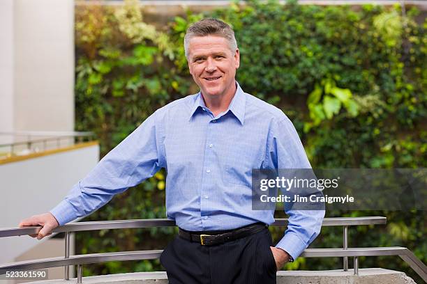 businessman leaning on a railing - jim craigmyle portrait stock pictures, royalty-free photos & images