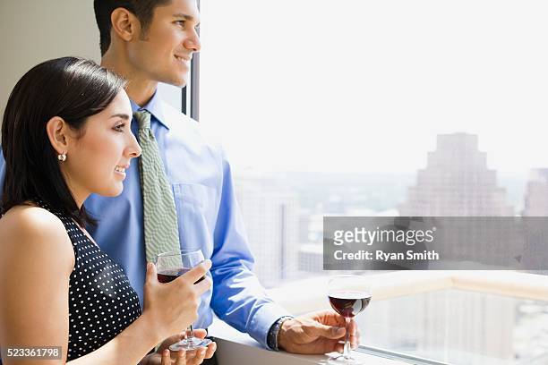couple looking out window - beautiful perfection exposed lady stock pictures, royalty-free photos & images