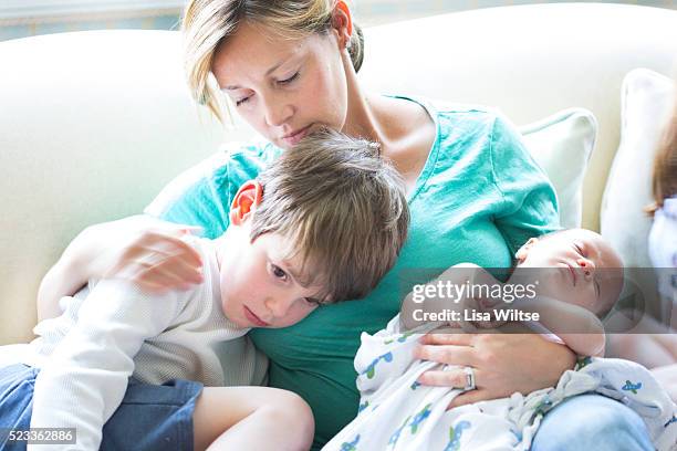 mother and her children - sad mum stock pictures, royalty-free photos & images