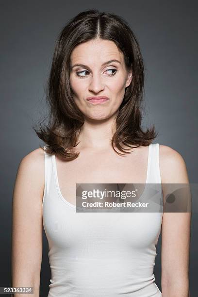 woman with dismissive sideglance - funny face woman stock pictures, royalty-free photos & images