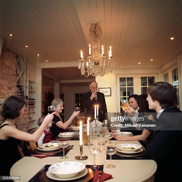 extended family around dining table - formal dining stock pictures, royalty-free photos & images