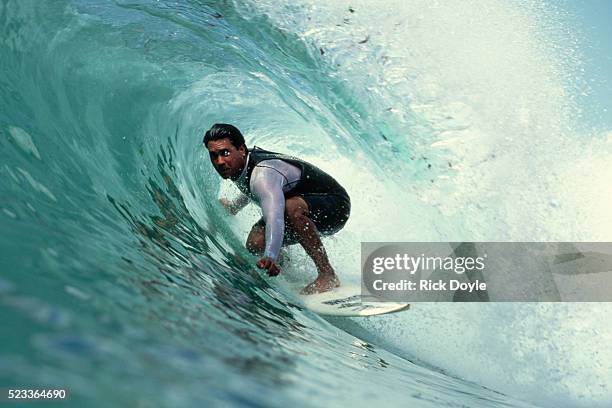 professional surfer riding a wave - surf stockfoto's en -beelden