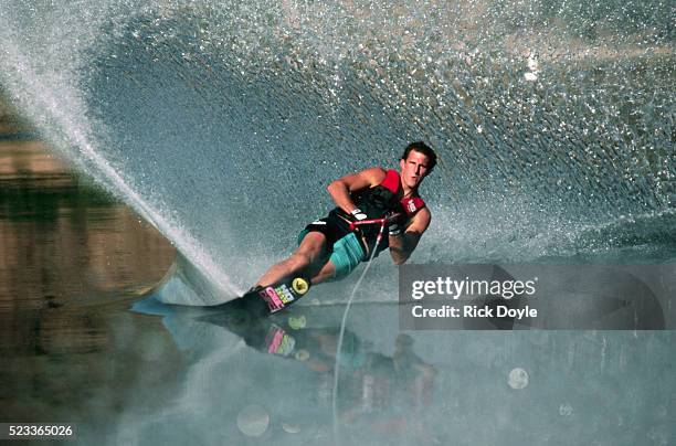 water skier in a slalom turn - waterskiing stock pictures, royalty-free photos & images