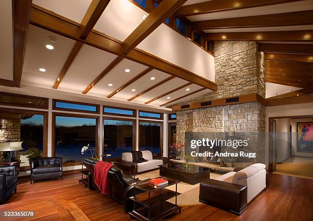 great room with stone fireplace - ceilings modern stock pictures, royalty-free photos & images