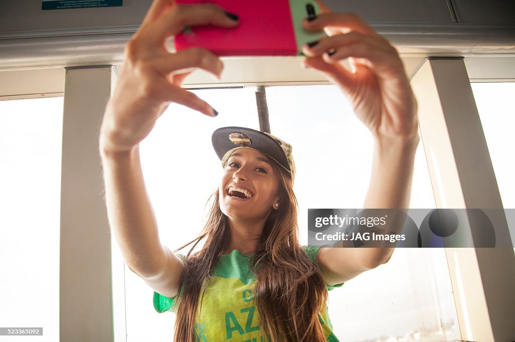 Young woman taking selfie, Rio de Janeiro, Brazil