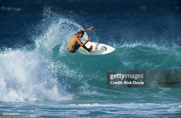 amateur surfer riding wave - surfing stock pictures, royalty-free photos & images