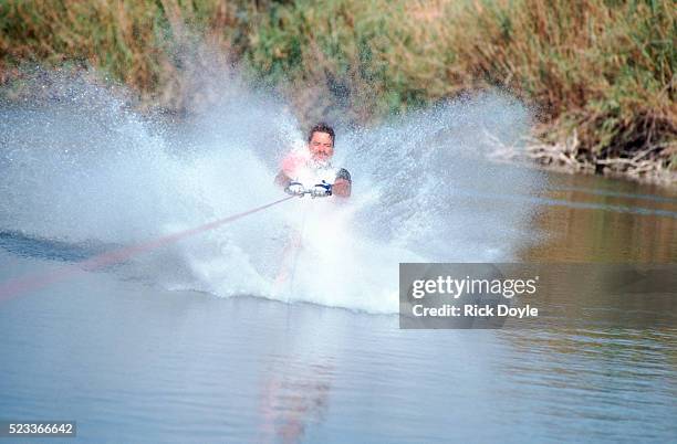 art marino doing a water skiing trick - barefoot skiing stock pictures, royalty-free photos & images