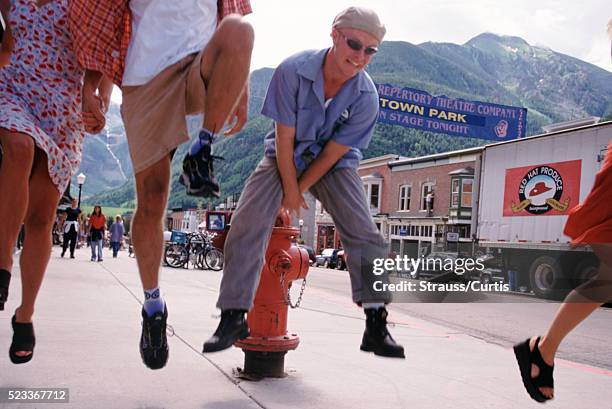 group of young adults cavorting in the streets - skipping along stock pictures, royalty-free photos & images