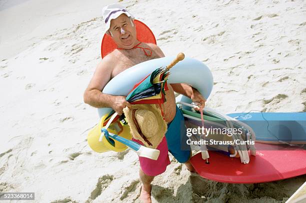 prepared for the beach - fat guy on beach fotografías e imágenes de stock