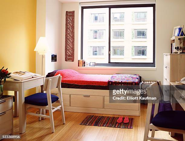 dorm room with storage bed and desks - 寮の部屋 ストックフォトと画像