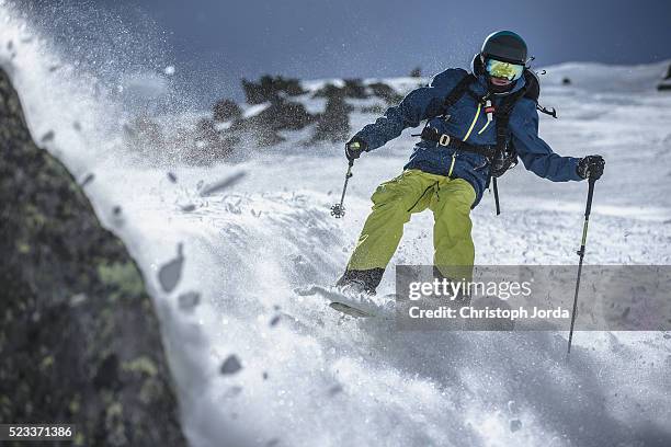 free skier riding through the powder snow - andermatt stock pictures, royalty-free photos & images