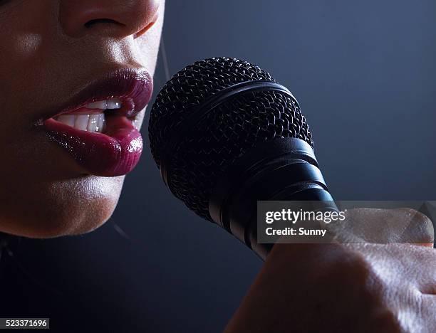 singer with microphone - microphone mouth stock pictures, royalty-free photos & images