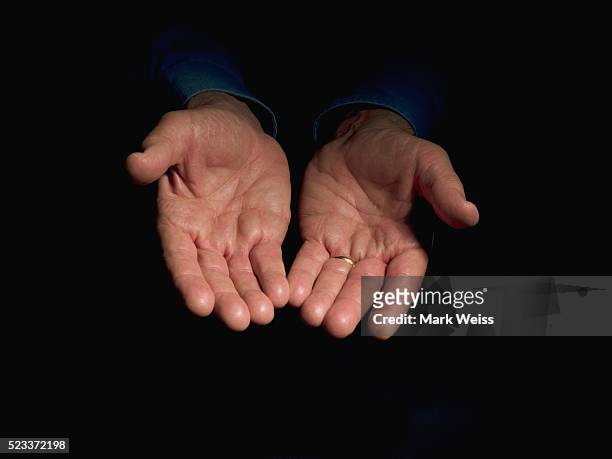 man with hands cupped - kindness stock pictures, royalty-free photos & images