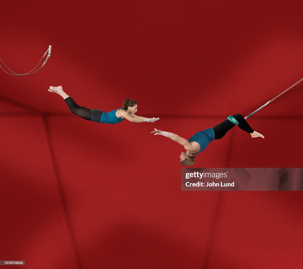 Acrobats Performing on Trapeze