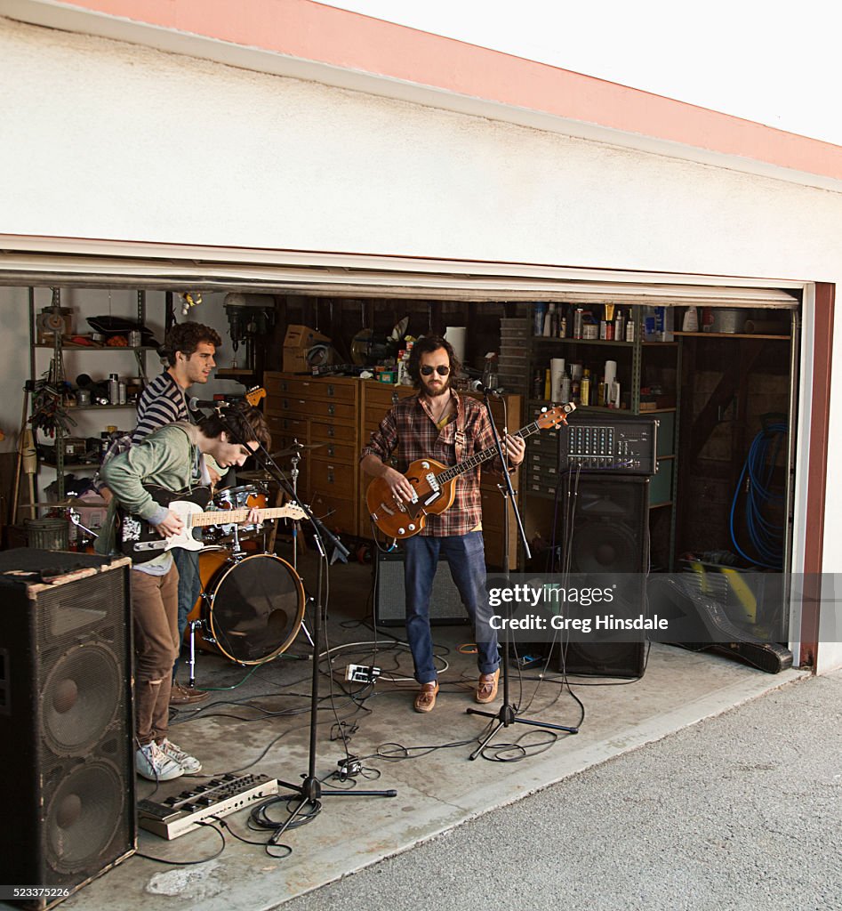 Rock band rehearsing in garage