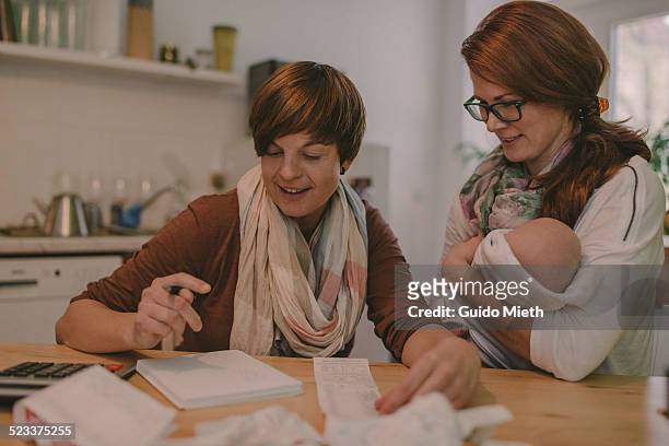 couple doing household  budget. - family budget stock pictures, royalty-free photos & images