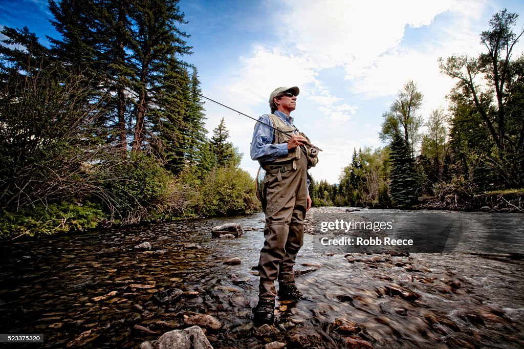 Fly fisherman standing in stream in Lake City, Colorado