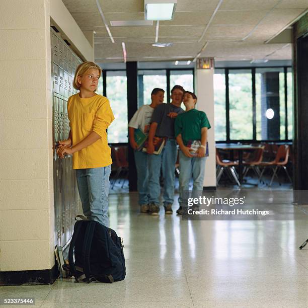 teen boys watching girl at locker - teasing stock pictures, royalty-free photos & images