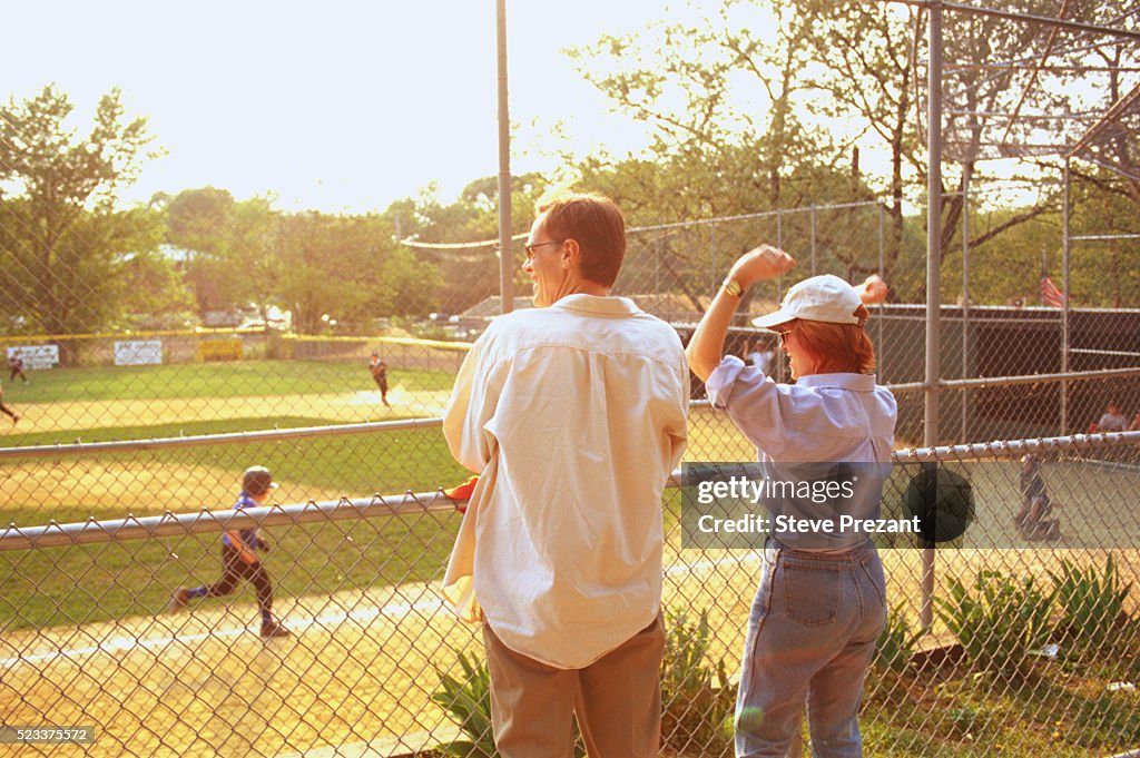 Parents Cheering at Little League Game