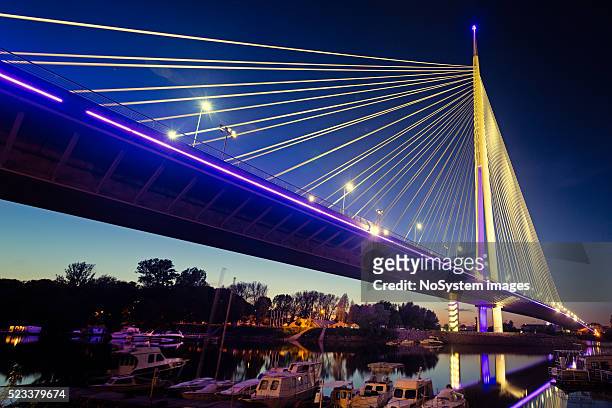 ada bridge at night, belgrade, serbia - belgrade serbia stock pictures, royalty-free photos & images