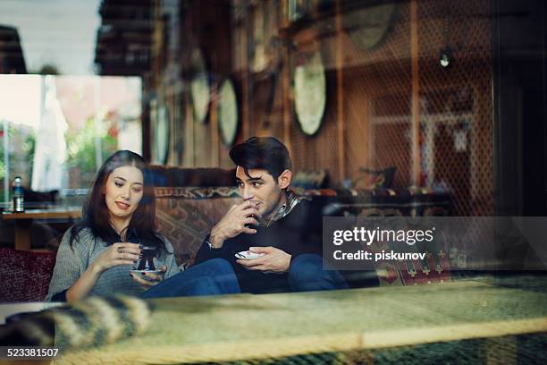 Turkish Couple in Cafe Use Tablet