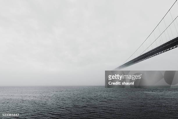 bridge in fog bank - bridge fog stock pictures, royalty-free photos & images