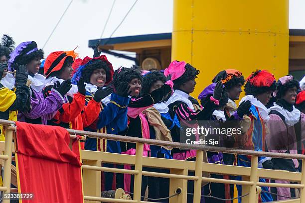 zwarte pieten (black pete) on deck of the steamboat - zwarte piet stock pictures, royalty-free photos & images