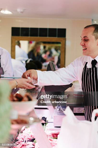 british butcher's customer - butcher stock pictures, royalty-free photos & images