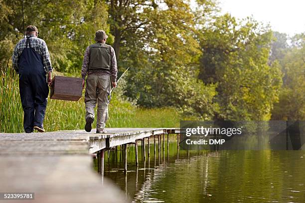 senior adults going for fishing at the lake - fiskeväst bildbanksfoton och bilder