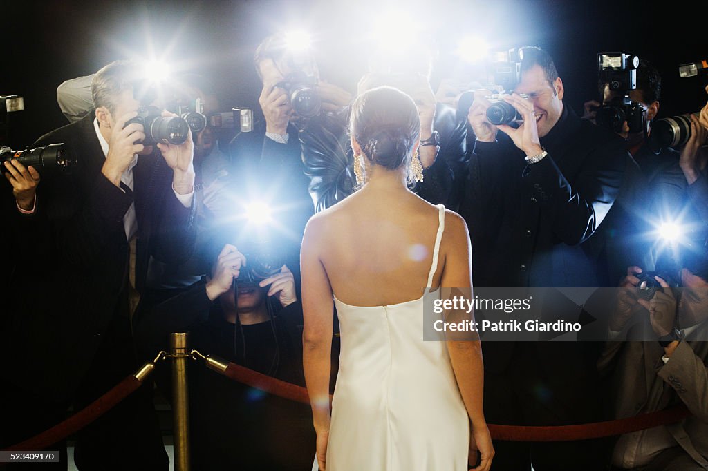 Paparazzi Photographing Celebrity at Red Carpet Event