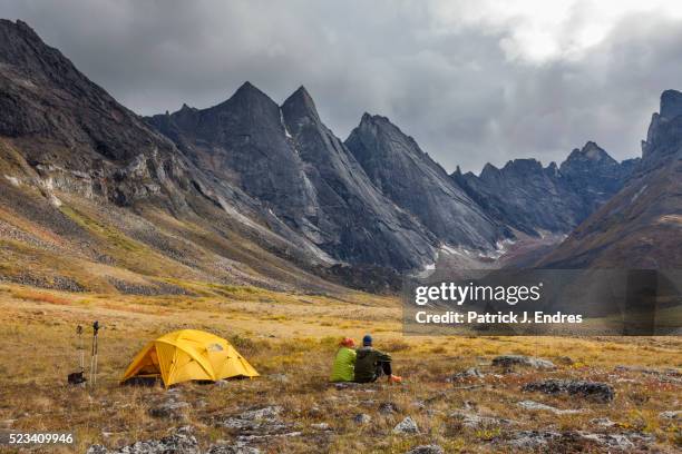 couple relax by campsite - terrain stock pictures, royalty-free photos & images