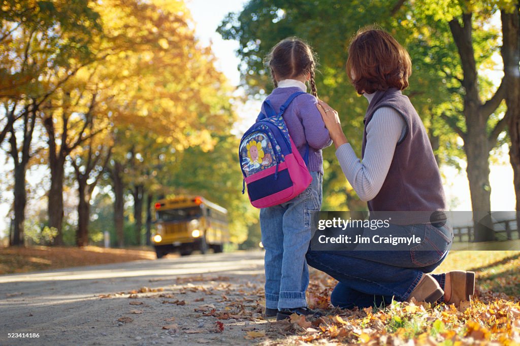 Mother and Daughter Waiting for School Bus