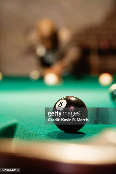 8 ball on billiards table - playing pool stock pictures, royalty-free photos & images