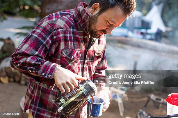 man and coffee while camping - archival camping stock pictures, royalty-free photos & images