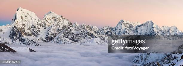 snowy mountain peaks panorama soaring above the clouds himalayas nepal - gokyo valley stock pictures, royalty-free photos & images