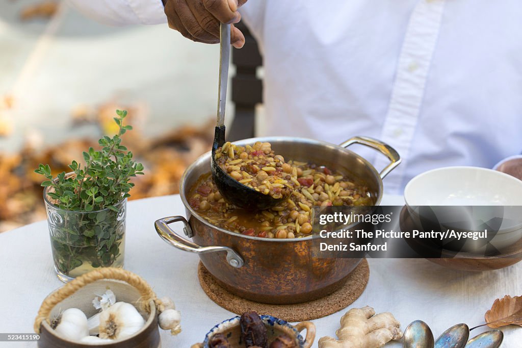 A Bowl of Harira - Indian Style Hearty Soup made with lentils, chickpeas, celery, ginger, tomatoes,