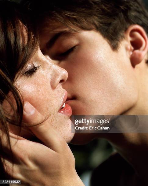 couple kissing - peck stock pictures, royalty-free photos & images