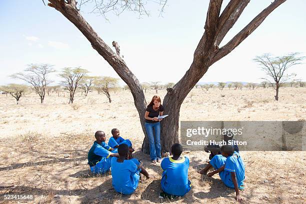 teacher conducting lesson with school girls, kenya - east africa stock pictures, royalty-free photos & images